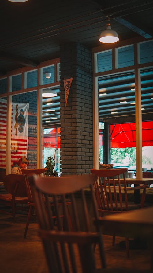 Wooden Tables and Chairs inside a Restaurant