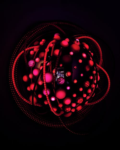 A Red Lighted Object on Dark Background