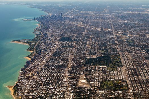 Stunning aerial panorama of Chicago revealing the city skyline, Lake Michigan, and urban sprawl.