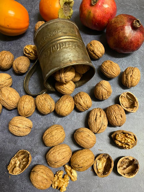 Foto profissional grátis de alimento, caquis, conchas