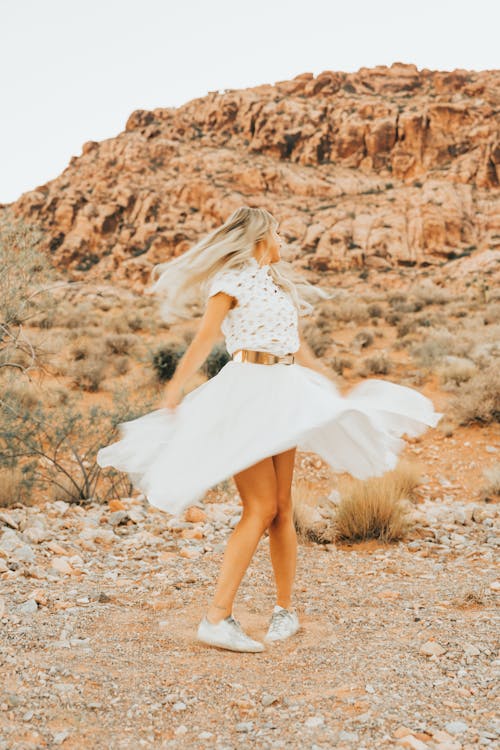 Woman Wearing a White Skirt Spinning