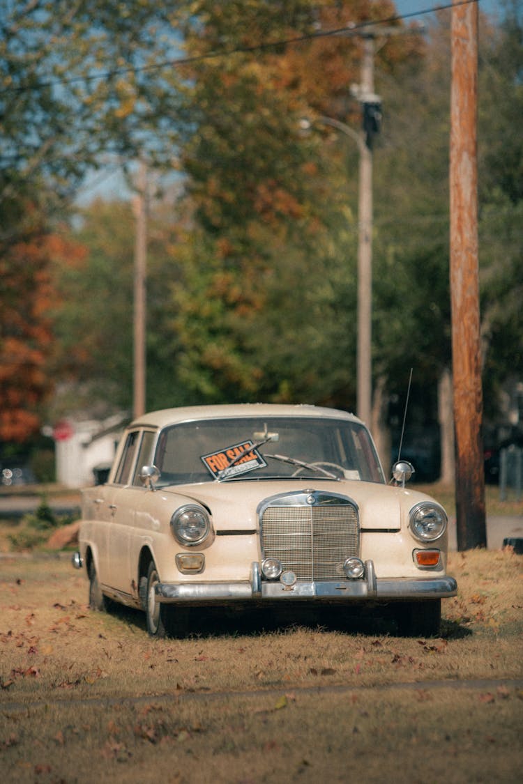 A Beige Vintage Car Parked 