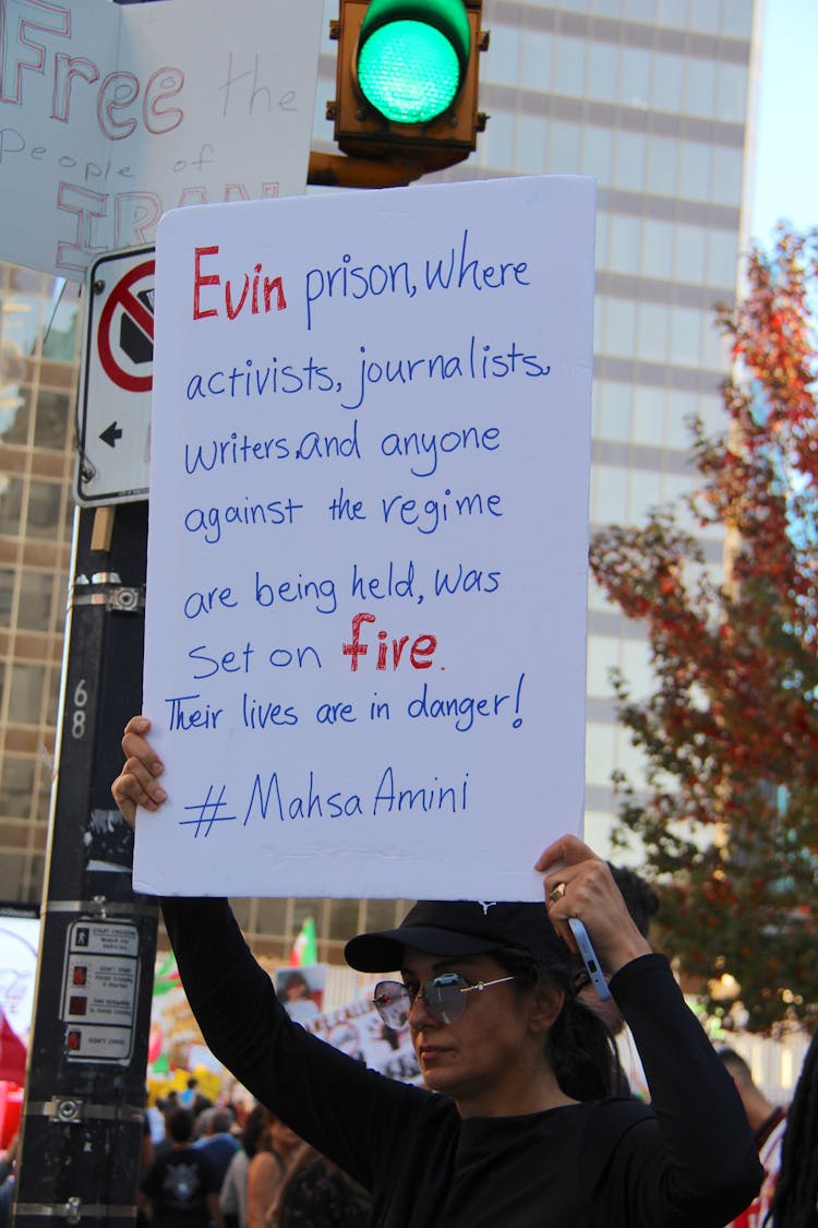 A Protester Holding A Sign