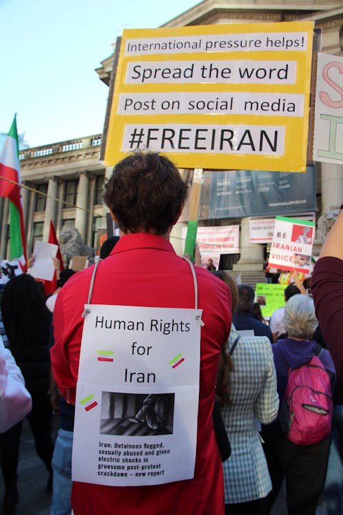 Back View of a Protester Holding a Placard