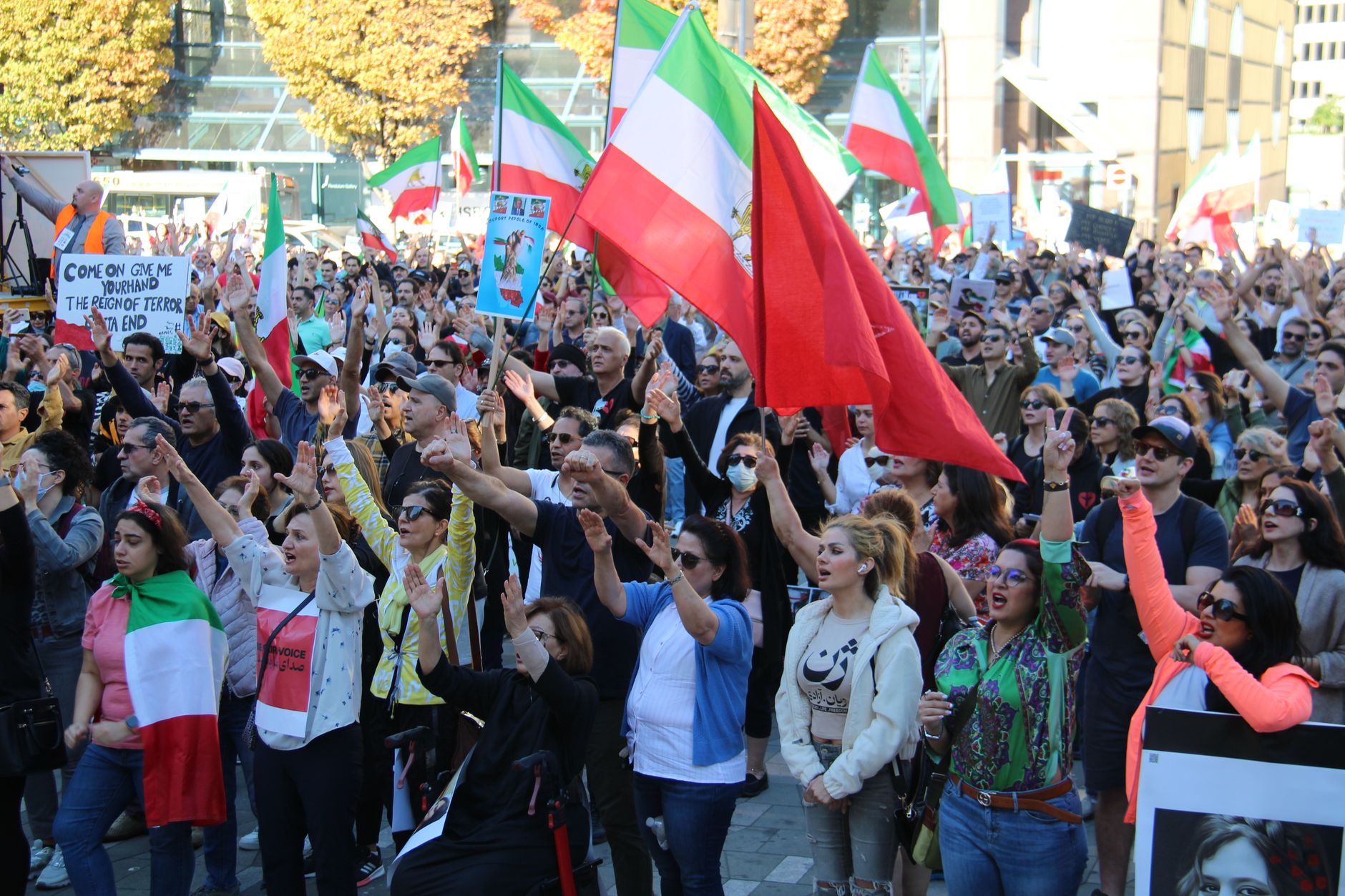 Crowd participating in a peaceful protest in Vancouver for freedom and justice in Iran.