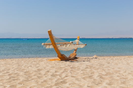 Serene beachfront hammock on the white sands of Safaga, Egypt, by the clear blue Red Sea.