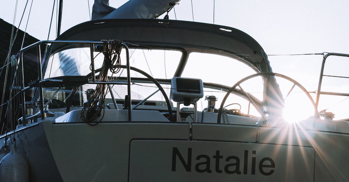Rüyada Natalie Portman ile Karşılaşmak - Rüya Tabiri ve Anlamı - A sailboat named 'Natalie' docked at the marina during sunrise, showcasing serene nautical beauty.