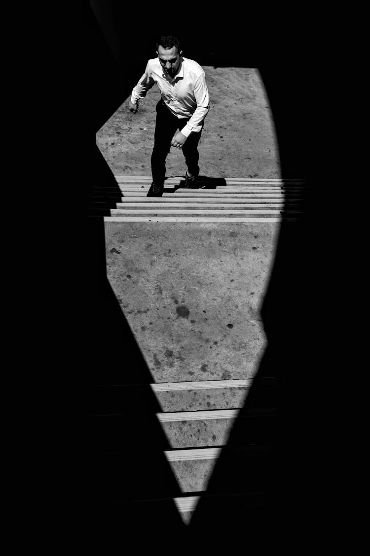 A Man Walking Up The Stairs 