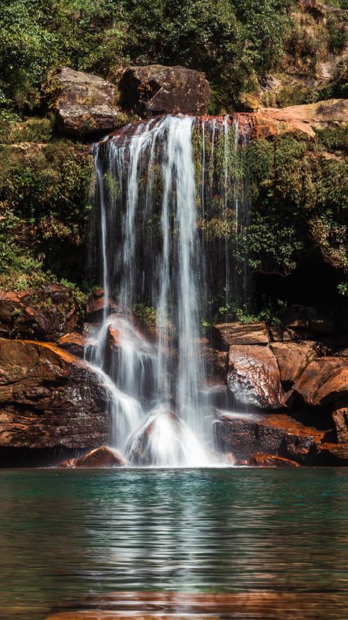 Free Scenic waterfall cascading in lush setting in Cherrapunji, Meghalaya, India. Stock Photo