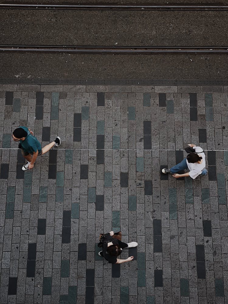 People Walking On The Sidewalk