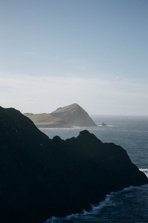 Clear Sky over Rock Formations on Sea Shore