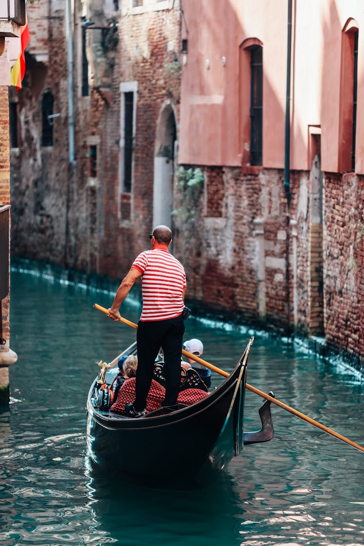 A Man Standing On The Boat