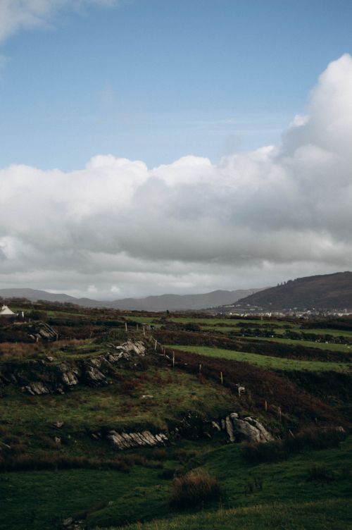 Free Beautiful rural landscape with rolling hills and dramatic clouds. Stock Photo