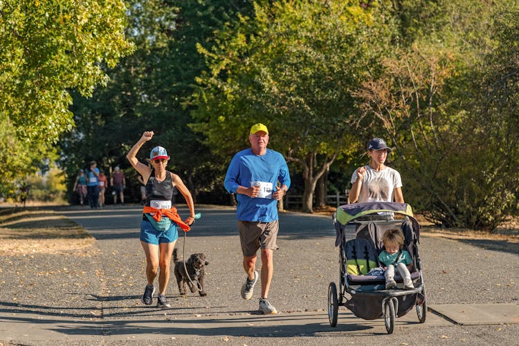 Woman Running With Her Pet Dog