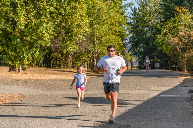 Man And Child Running Together