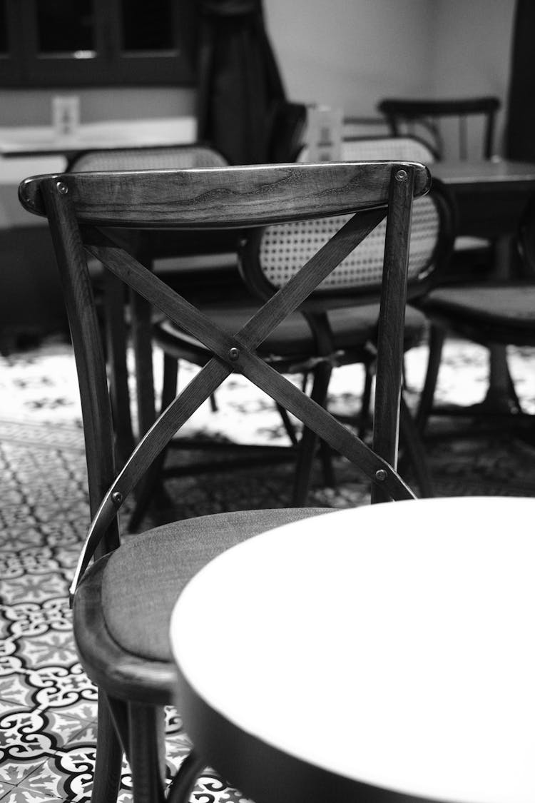 Grayscale Photo Of An Empty Seat