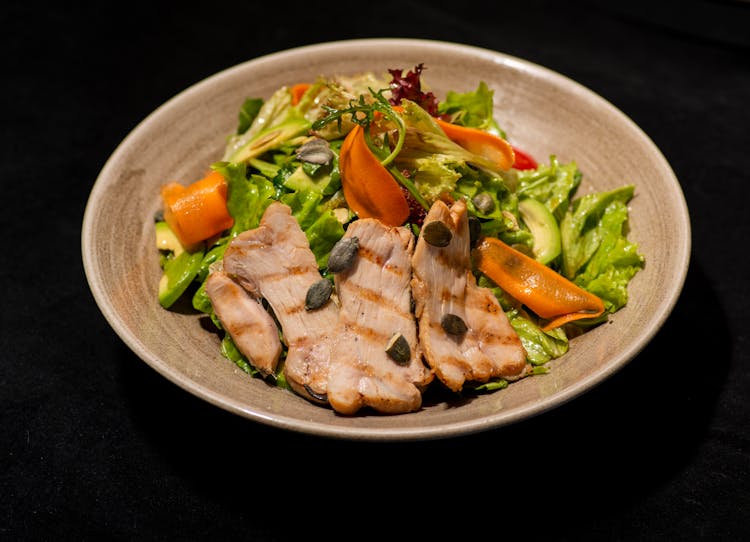 Grilled Meat On Top Of Salad