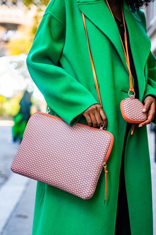 Woman in a Green Coat with a Handbag 