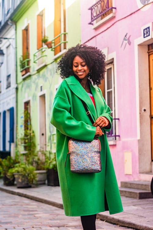 Woman Wearing Green Coat on a Street 
