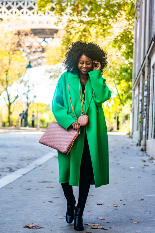 Woman Wearing Green Coat on a Street 
