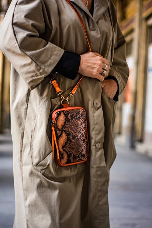 Woman Wearing Khaki Dungarees on a Street 