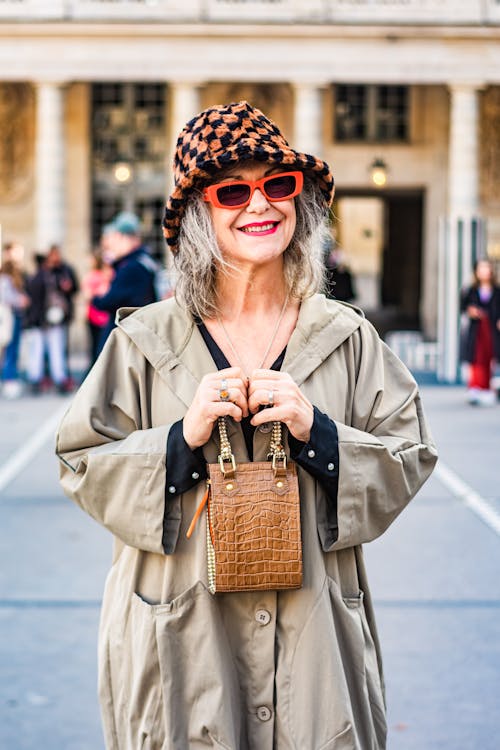 Fashionable Elderly Woman Carrying a Leather Handbag