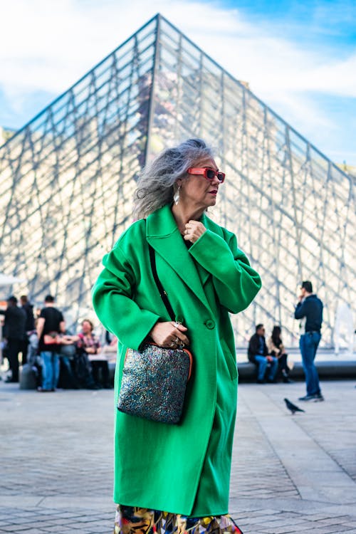 Woman Wearing Green Coat on a Square in Louvre 