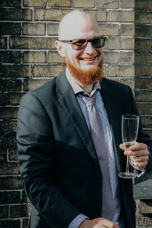 Free Man in Black Suit Holding Champagne Glass Stock Photo