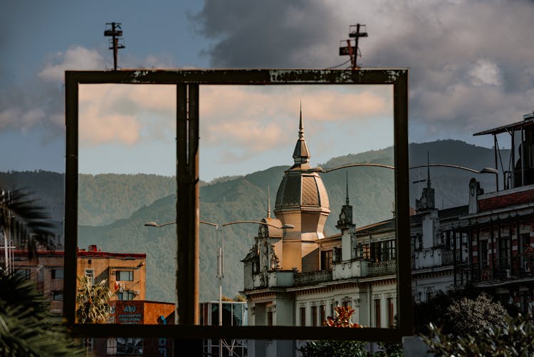 Catholic Church Behind Windows In Town