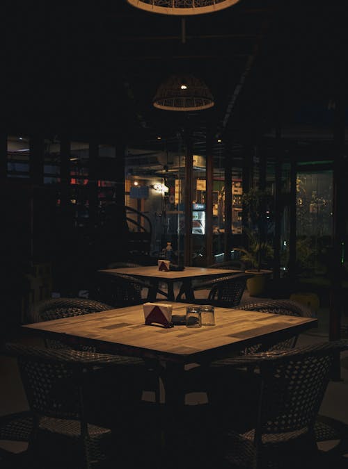 Wooden Tables in a Restaurant in Shadow 