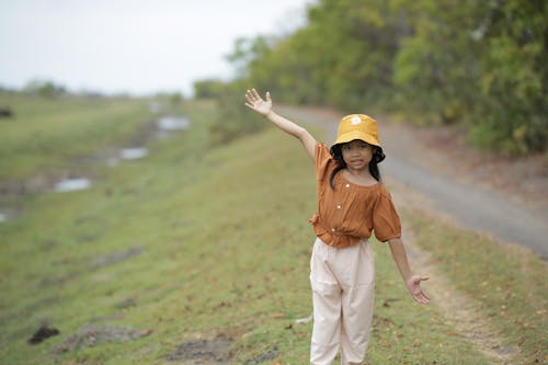 Photo of a Girl with a Bucket Hat Posing