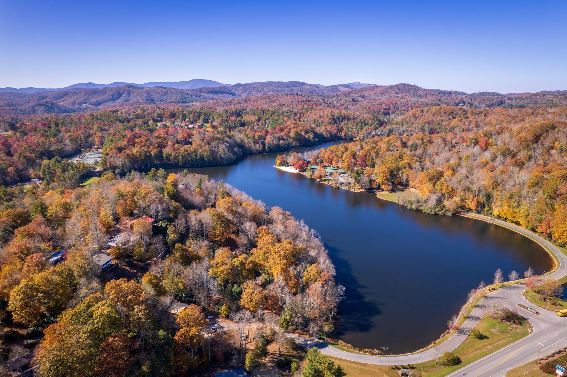 A picturesque aerial view of a lake and colorful autumn landscape in Newland, NC.