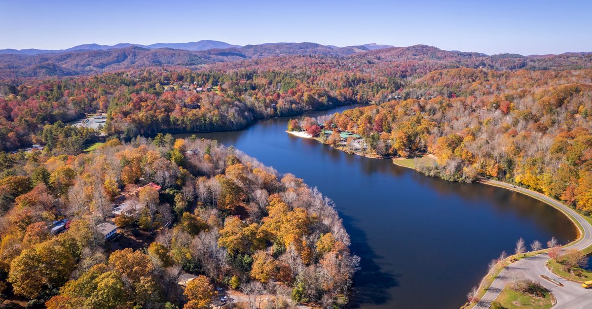 A picturesque aerial view of a lake and colorful autumn landscape in Newland, NC.