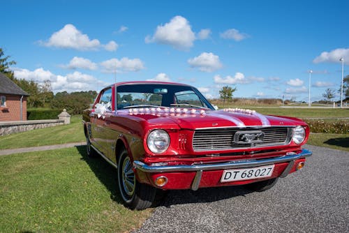 A Red Classic Car Parked on the Street