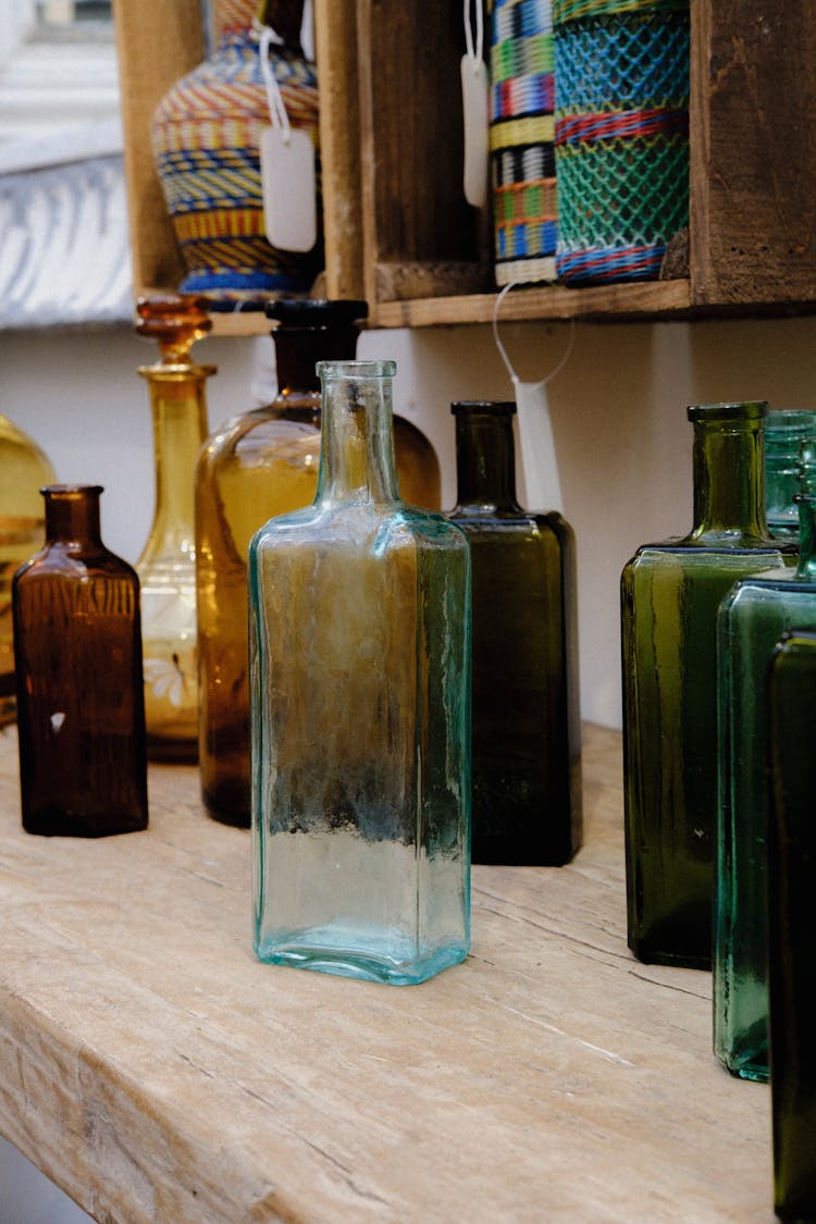 Empty Bottles On Top Of A Table