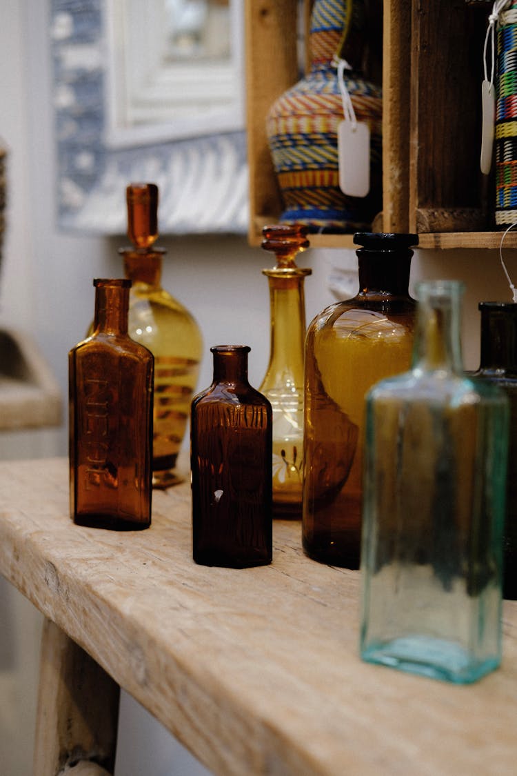 Empty Glass Bottles On Table