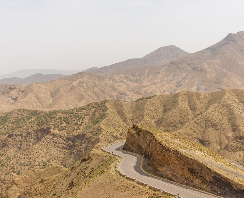 A scenic view of Morocco's Atlas Mountains with a winding road