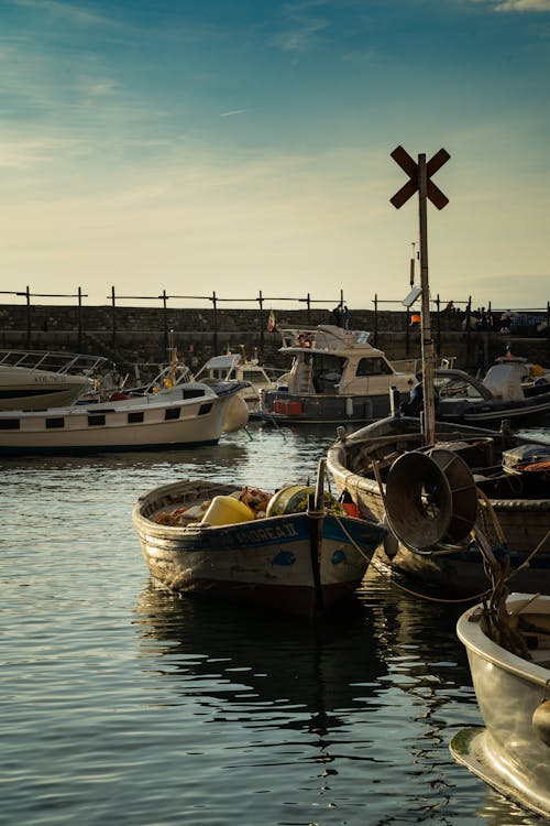 Boats and Motorbaots Docked on a Harbor