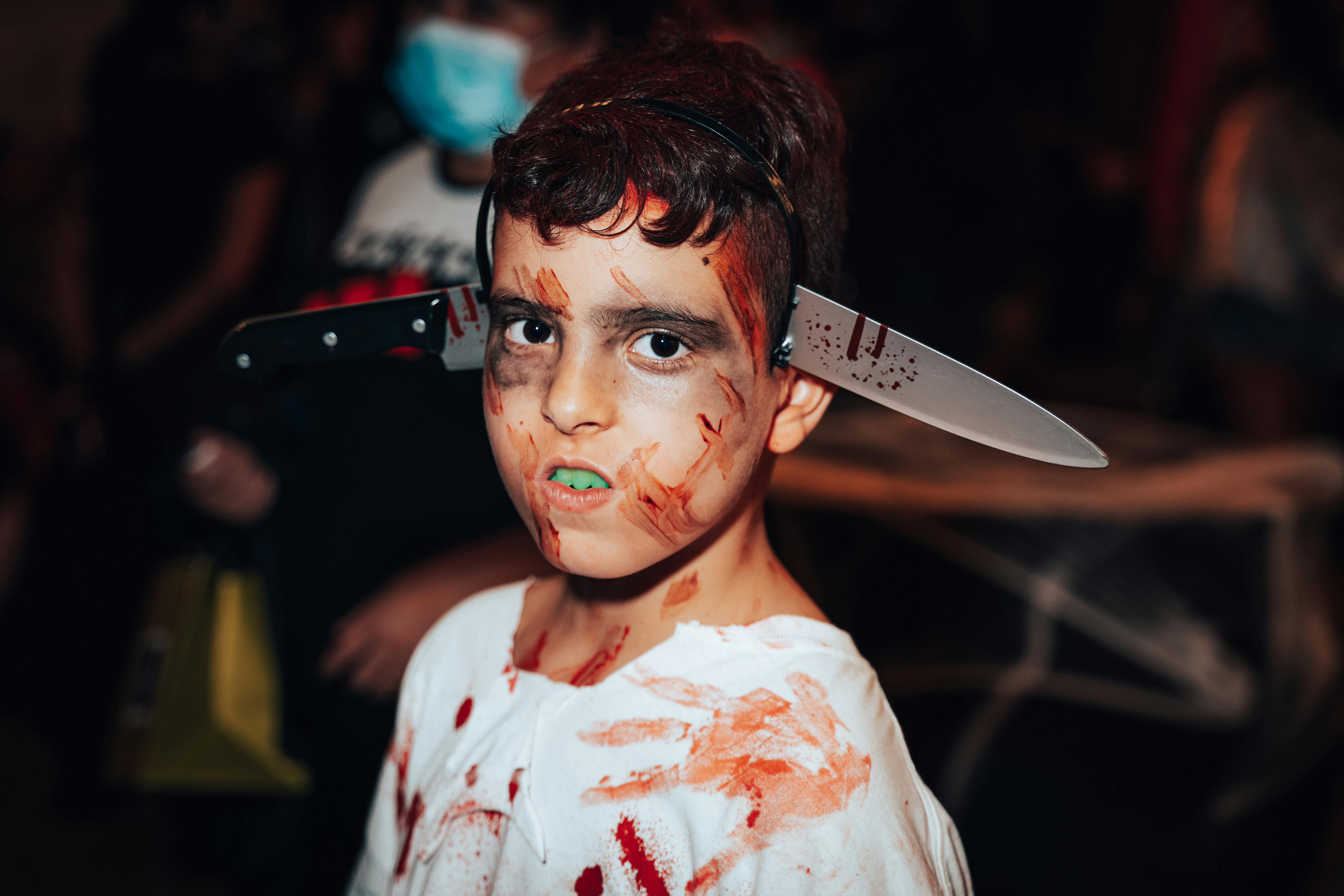 young boy wearing a halloween costume