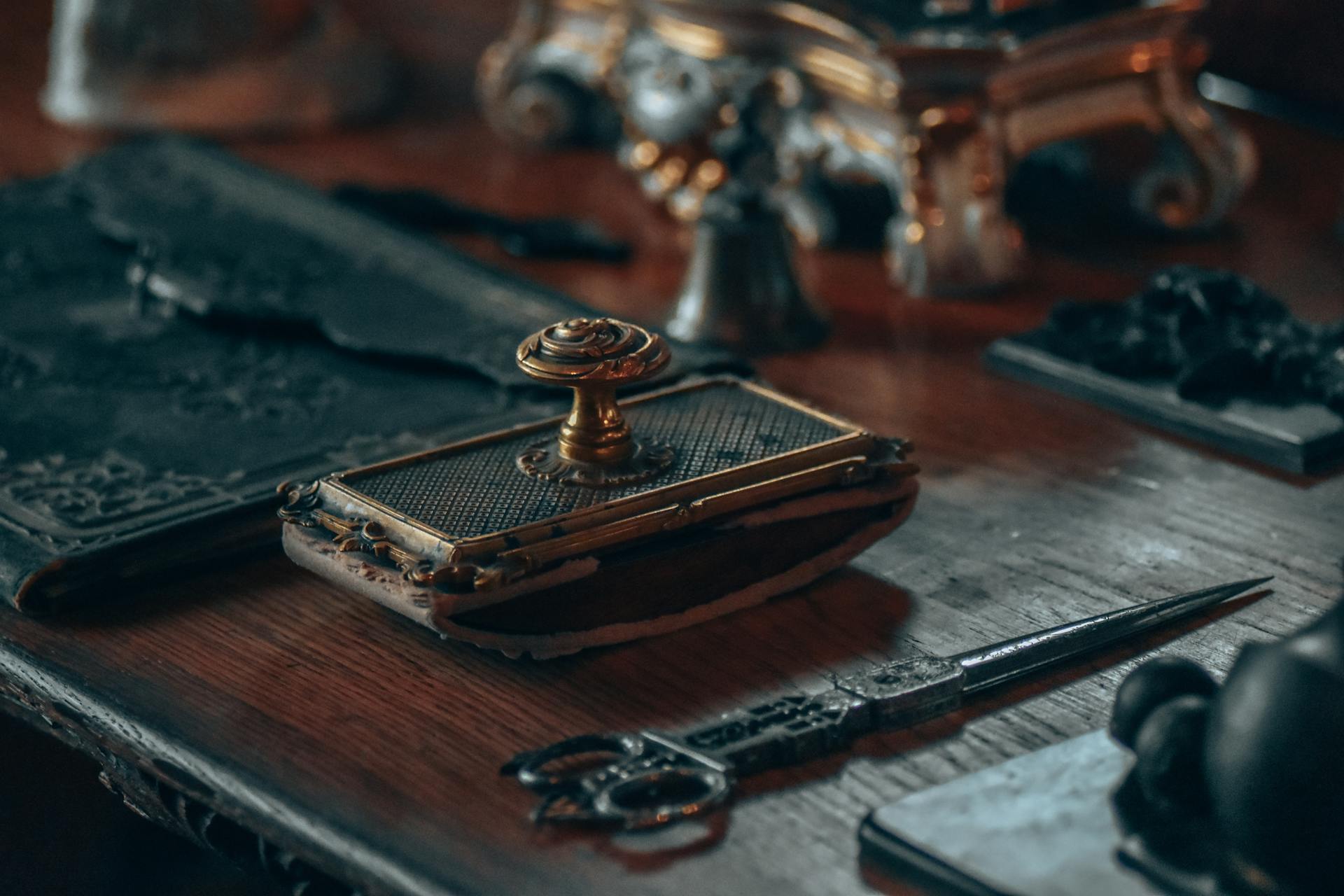 Stamp next to a Pair of Scissors