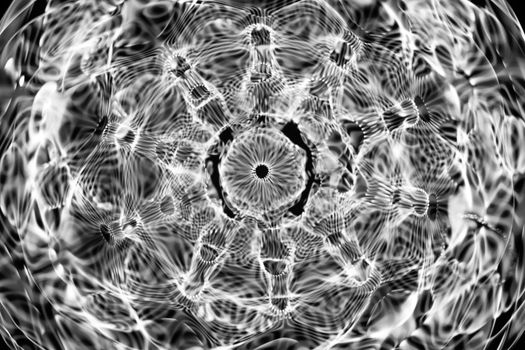 Intricate black and white abstract art with wave patterns, perfect for modern design.
