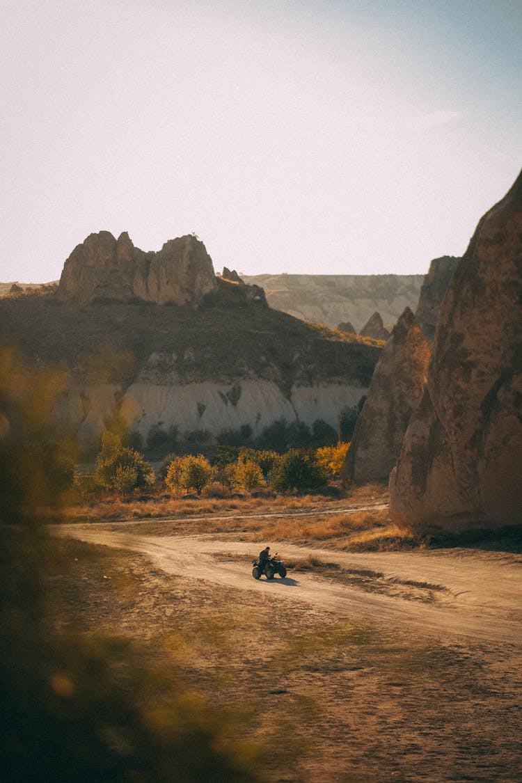 Vehicle Riding In Mountain Landscape