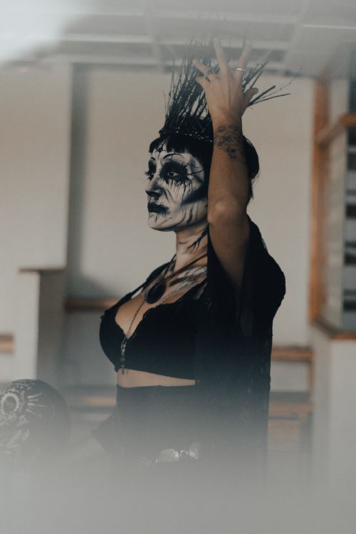 Free A dramatic portrait of a woman in intricate Halloween makeup and costume, indoors. Stock Photo