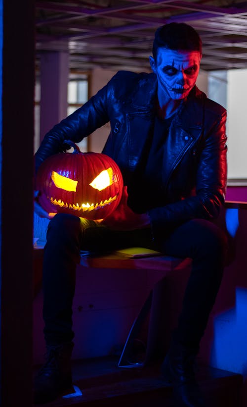 Man Posing with Halloween Pumpkin