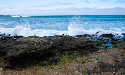 An Ocean Waves Crashing on a Rocky Shore