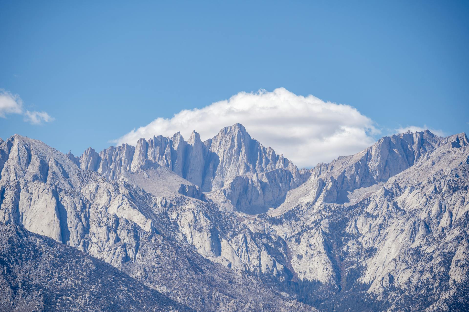 An Aerial Photography of Mount Whitney Under the Blue Sky and White Clouds