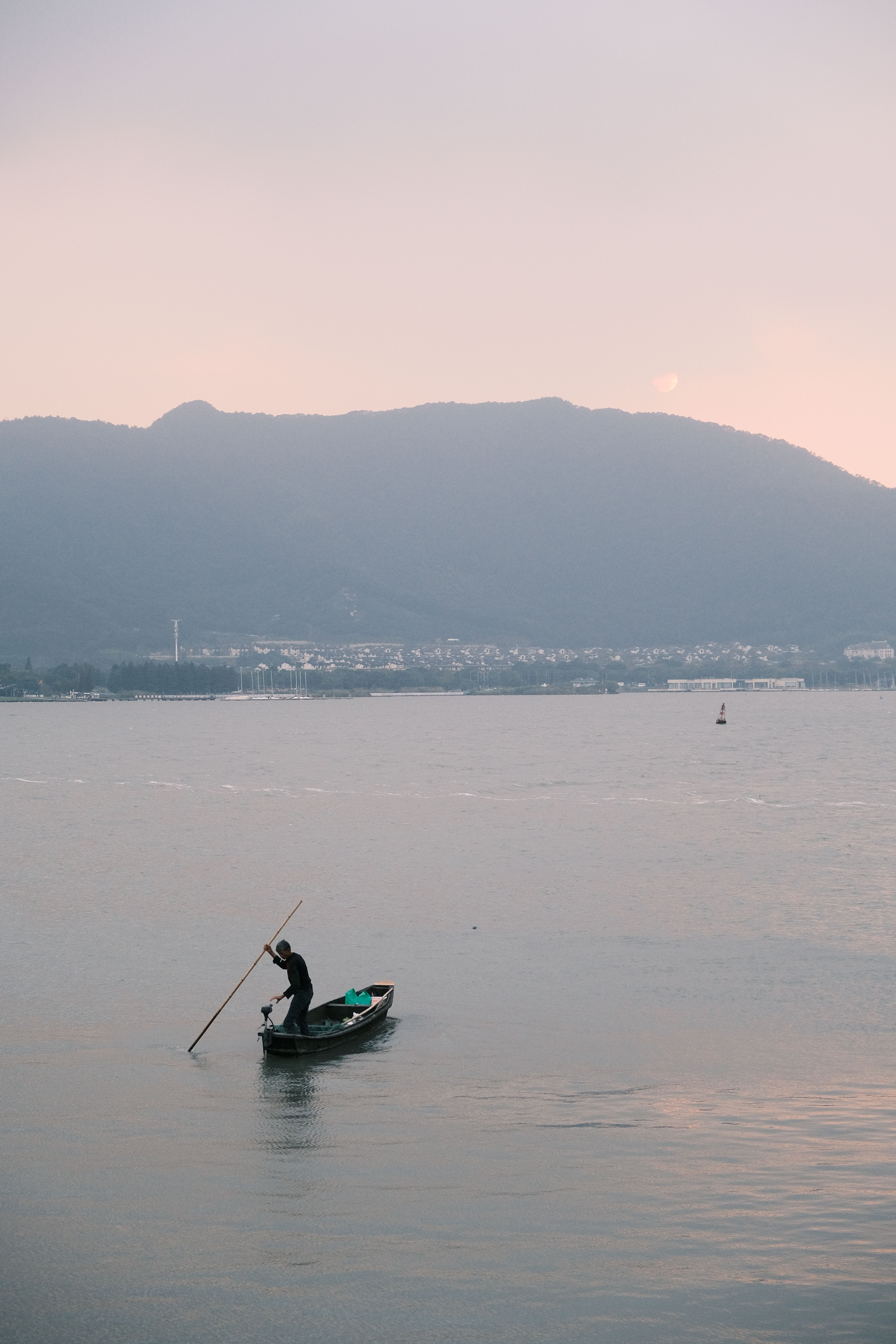 A Person Riding a Boat on the Sea · Free Stock Photo