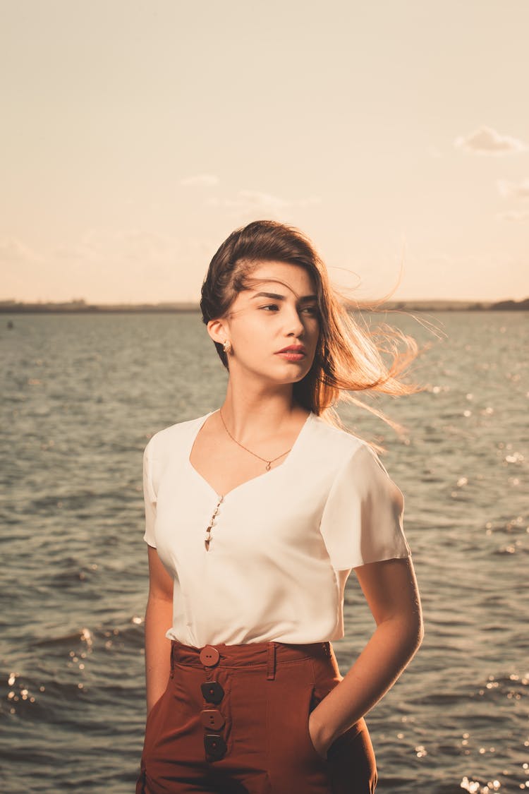 Woman Posing With Water Behind