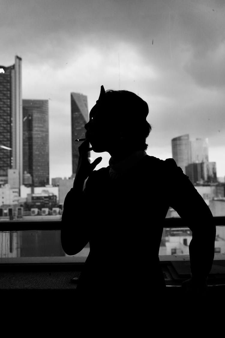 Silhouette Of A Person While Smoking Cigarette