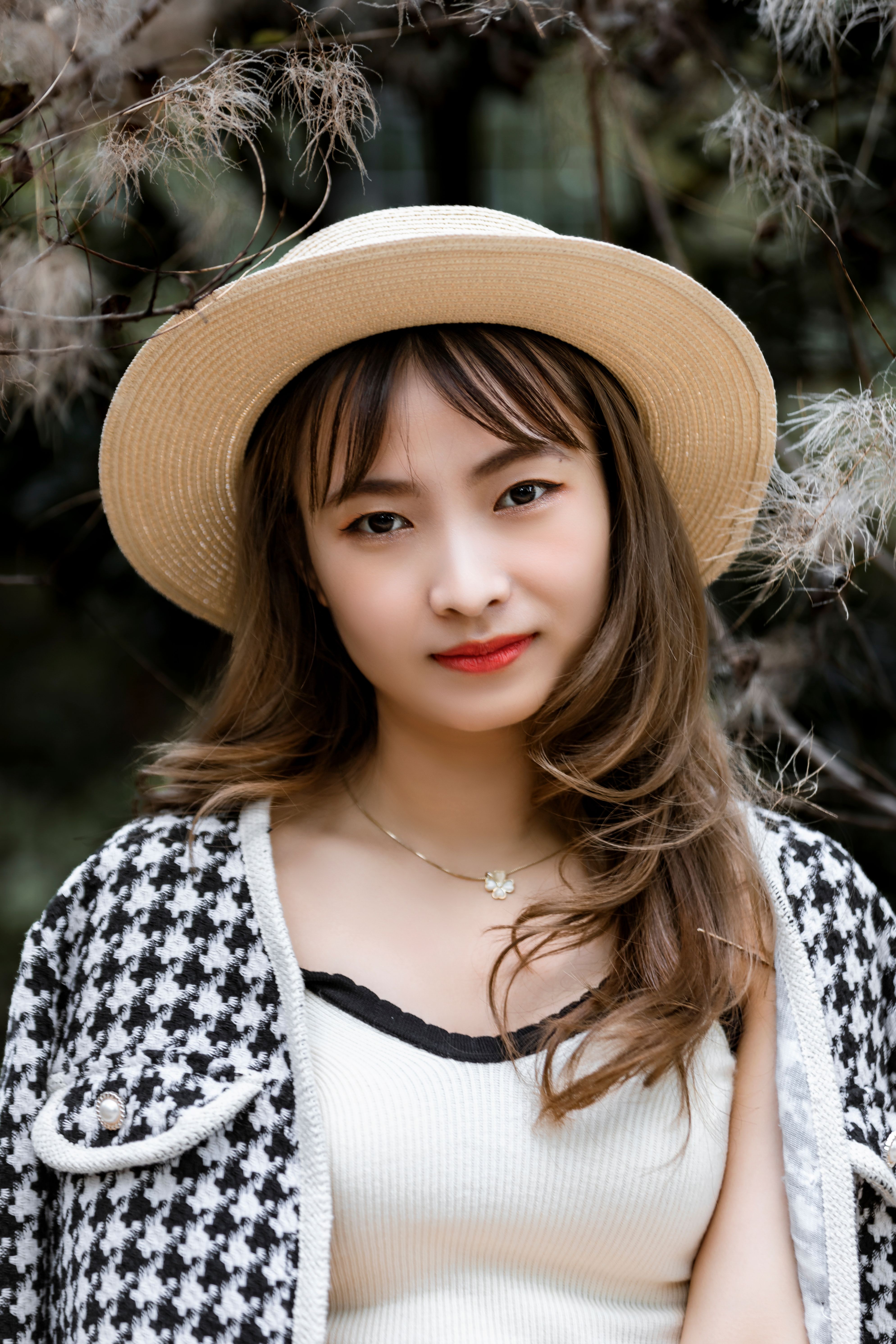 A Portrait of a Woman Wearing Brown Hat · Free Stock Photo